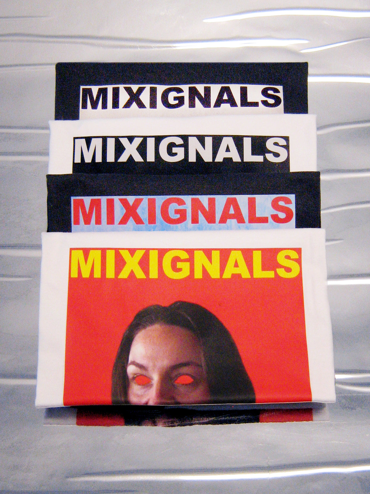 Stacked MIXIGNALS prints with the SIMHASANA lion-pose portrait on orange-red – MIXIGNALS by Alex Beriault
